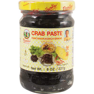 Jar of Pantai Norasingh brand fermented crab paste, 8 oz (227g), with a yellow lid and labeled in English and Thai.