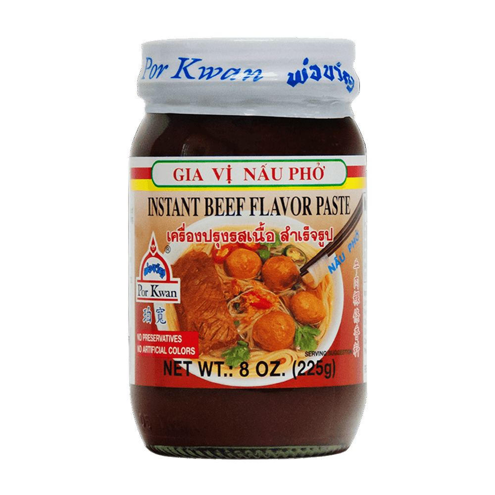 An 8 oz glass jar of Por Kwan Instant Beef Flavor Paste, with an image of white bowl with meatballs, diced red Thai chilis, sprinkled cilantro and noodles on the label.