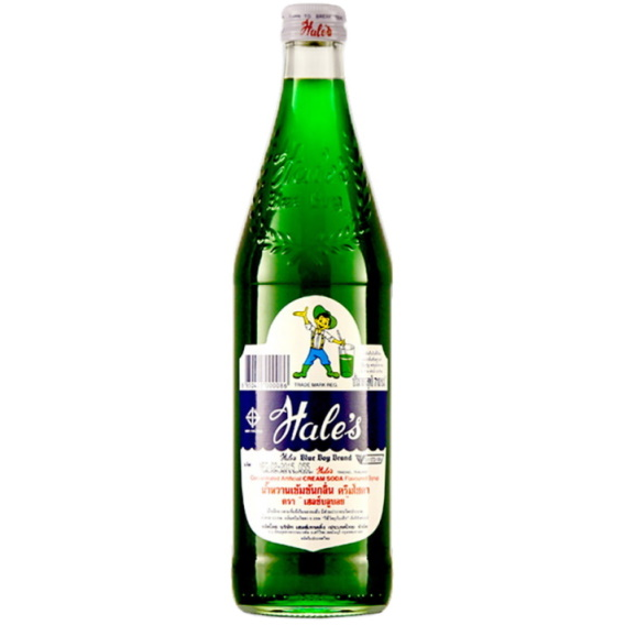 Green bottle with a label on a white background