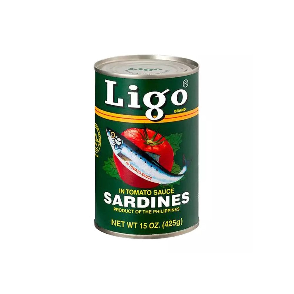 A 15 oz can of Ligo Brand In Tomato Sauce Sardines, featuring a dark green label with white text and an illustration of a sardine on a tomato, set against a plain white background.