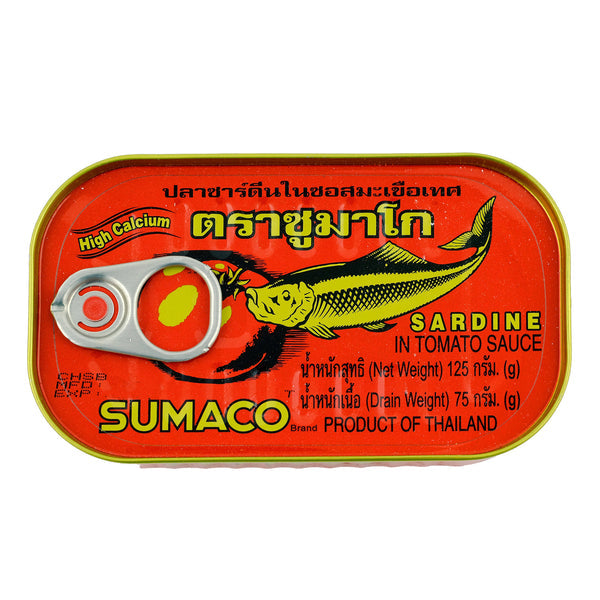 A tin of Sumaco Sardine in Tomato Sauce, featuring a bright red label with a cartoon fish, Thai text, and a silver pull-tab lid, isolated on a white background.