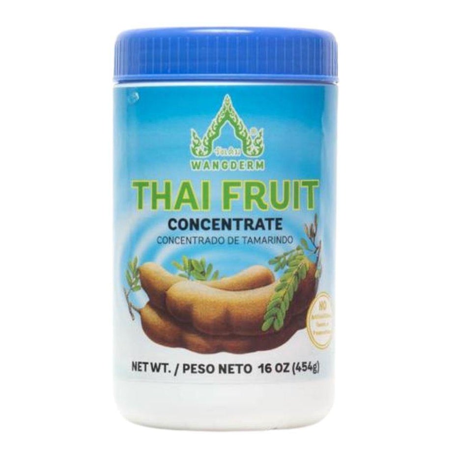 A container of Wangderm Thai Fruit Tamarind Concentrate with a visual representation of tamarind fruit and leaves on the label.