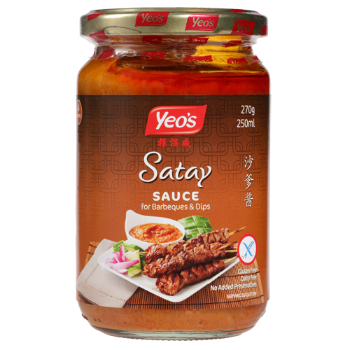 A glass jar of Yeo's Saty Satay Sauce for barbecues, displaying the product label with information and images of satay skewers with accompaniments.